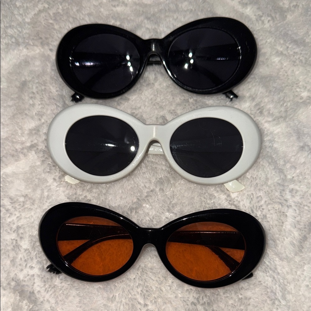 Elegant Black, White, and Orange Sunglasses Trio